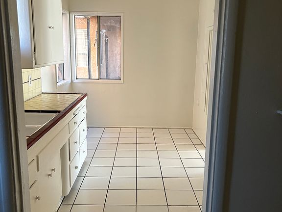 Opposite view of kitchen. Room for a table and chairs.