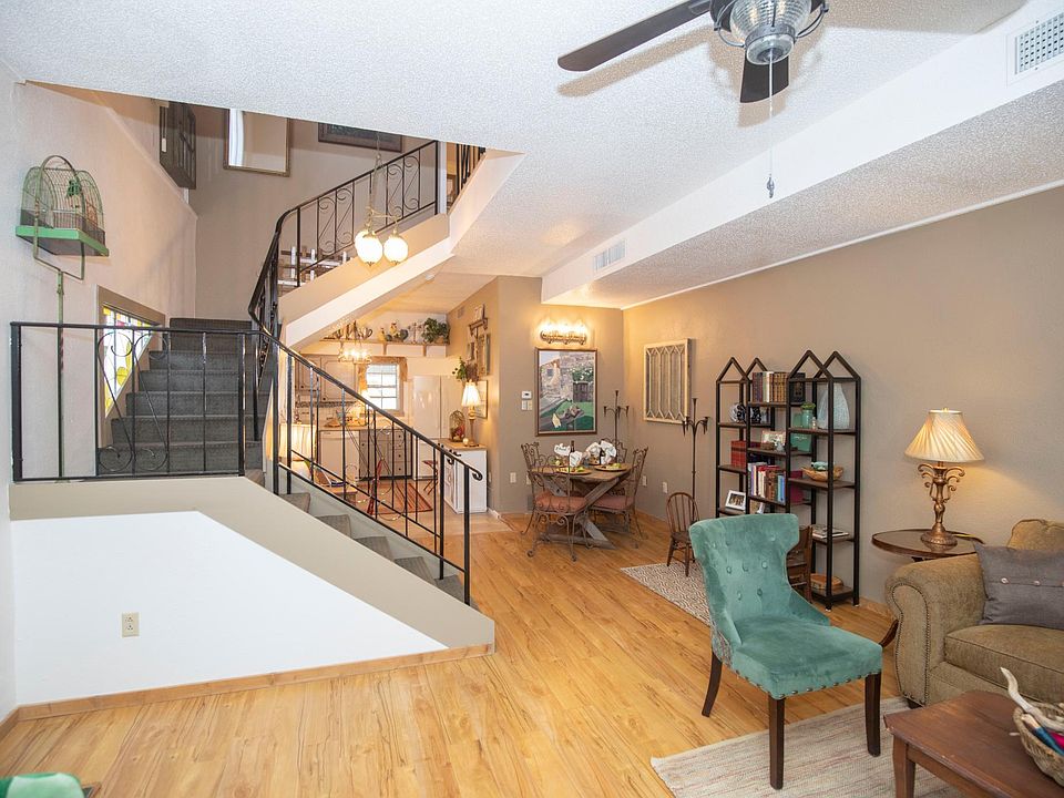 Spacious living/dining room combo with electric fireplace. Wood floors and vintage charm throughout the home.