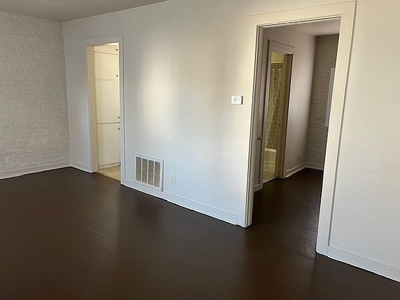 Living room - looking into bedroom (right) & kitchen (left)