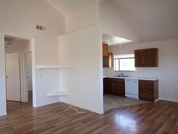 Living room and kitchen, hallway to bedrooms and bathrooms on the left
