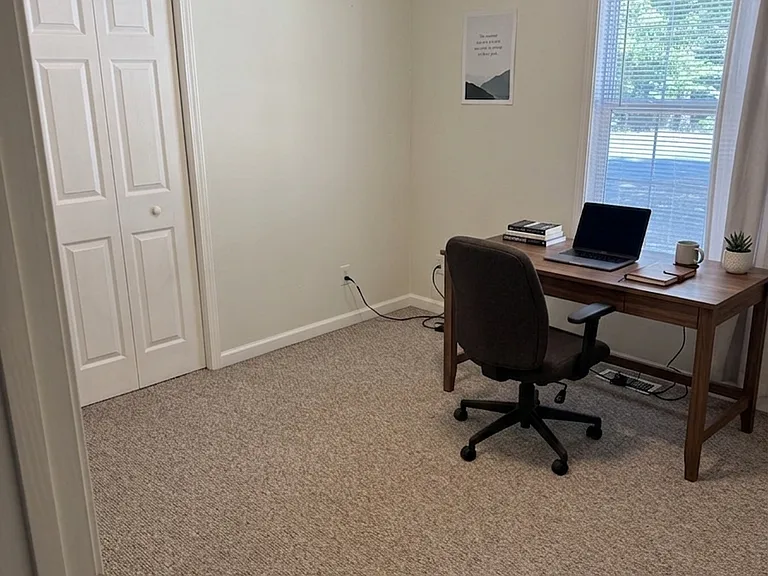 Versatile third bedroom ideal for guests, family, or a home office setup.
