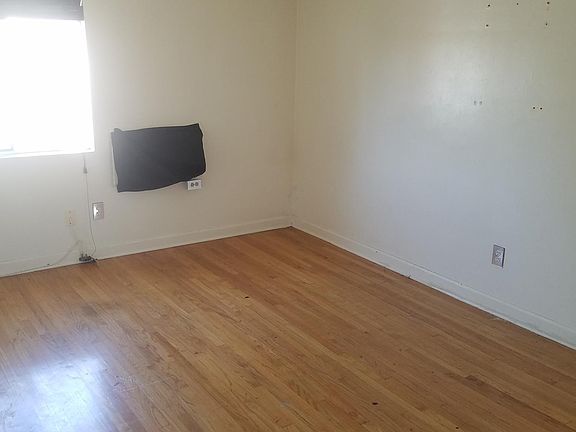 Other view of the bedroom with the built-in desk and ceiling fan...plus lots of natural light and unobstructed views from the wi