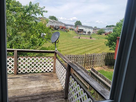 Deck and fenced in backyard.