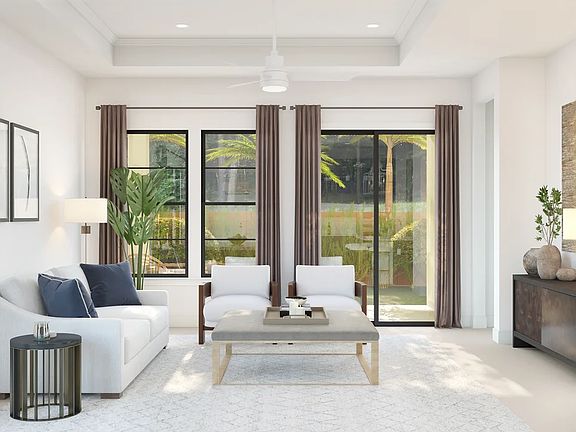 Great room with coffered ceiling and crown moulding