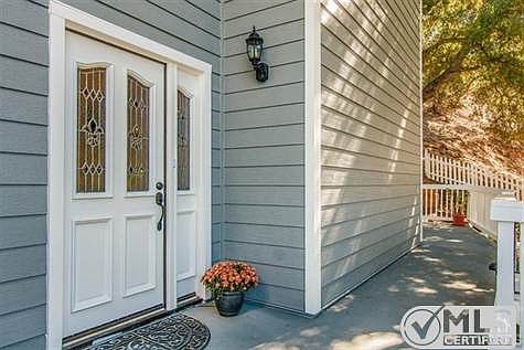 Large Front Porch Wraps Around Back