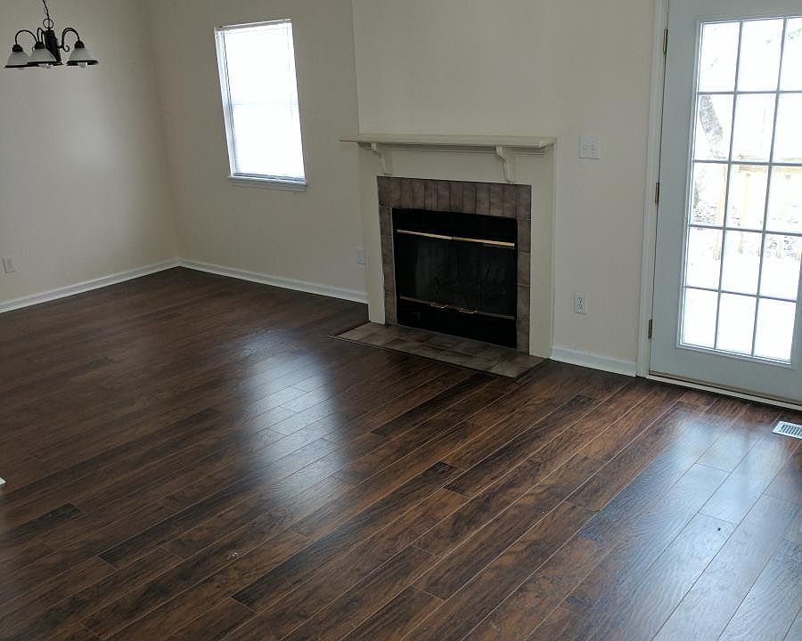 Living room with wood burning fireplace