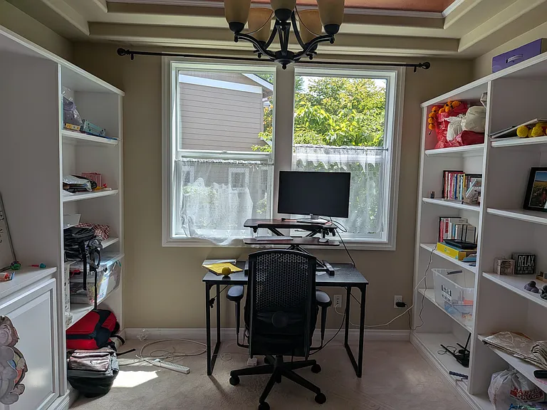 Office/study room on the ground floor, with cupboard space on both sides.