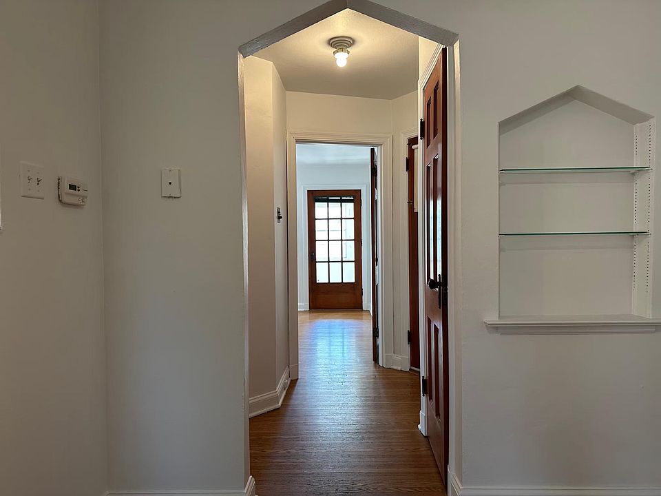 Hallway leading to the bathroom and bedroom