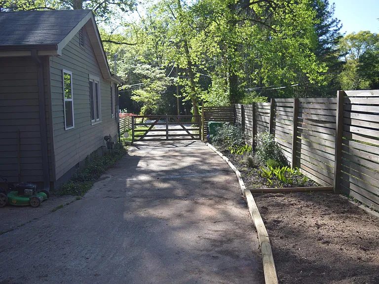 Driveway gate and side garden.