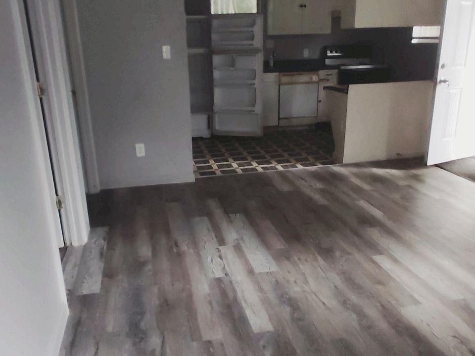 LIVING ROOM & PARTIAL VIEW OF KITCHEN