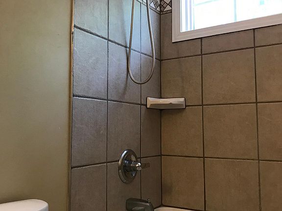 Custom tiling, soaking tub in both bathrooms.
