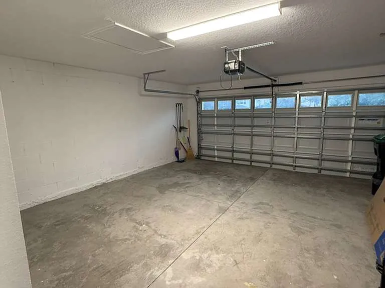 Garage with two parking spots inside, and two outside.
