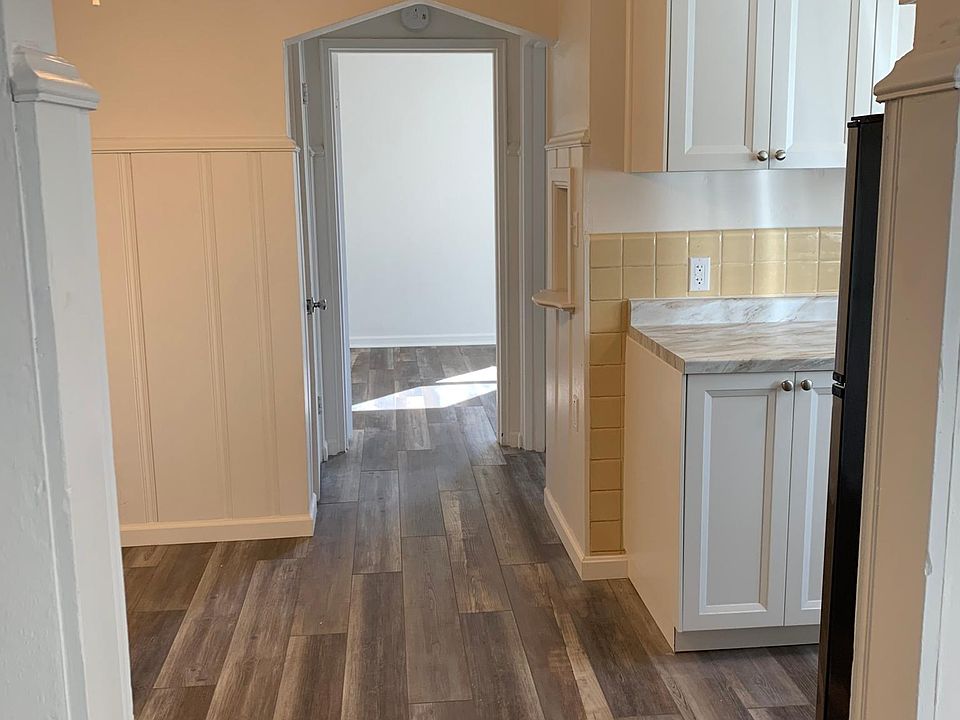 View going into dining area on left and kitchen on right