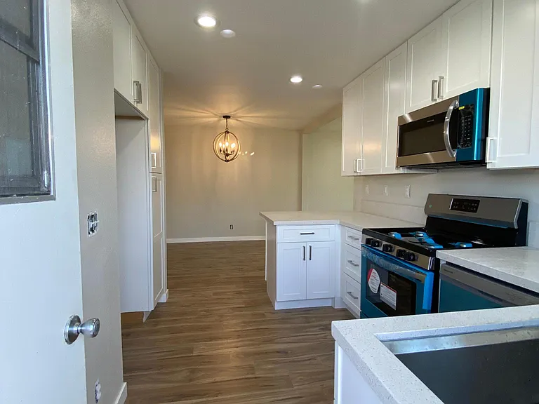 Private side entry door into kitchen.