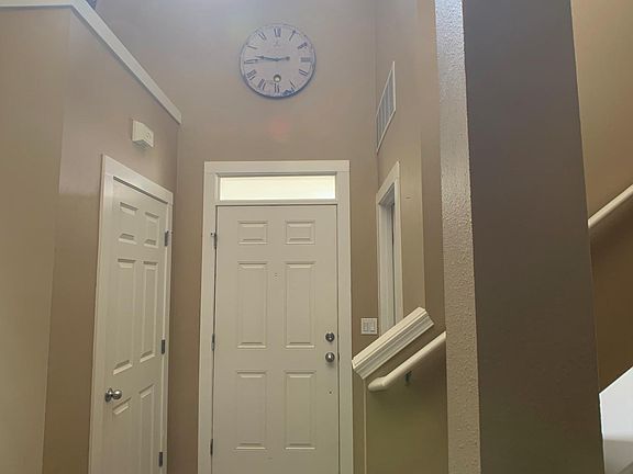 Entry way with coat closet and 1/2 bath.