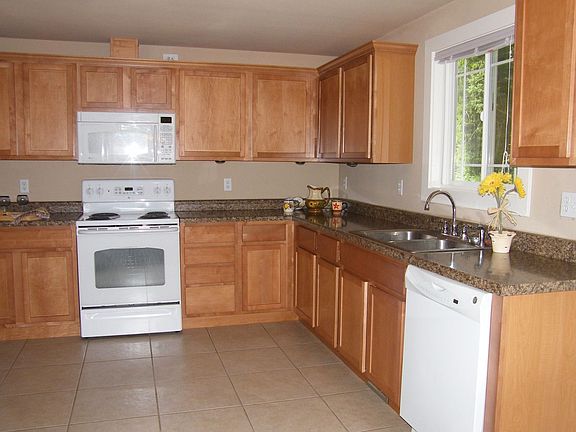 Home is totally updated, with all new kitchen, tile floor, white appls
