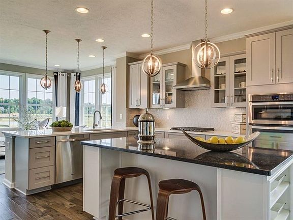 This photo is a model home photo or artist rendering due to construction stage.