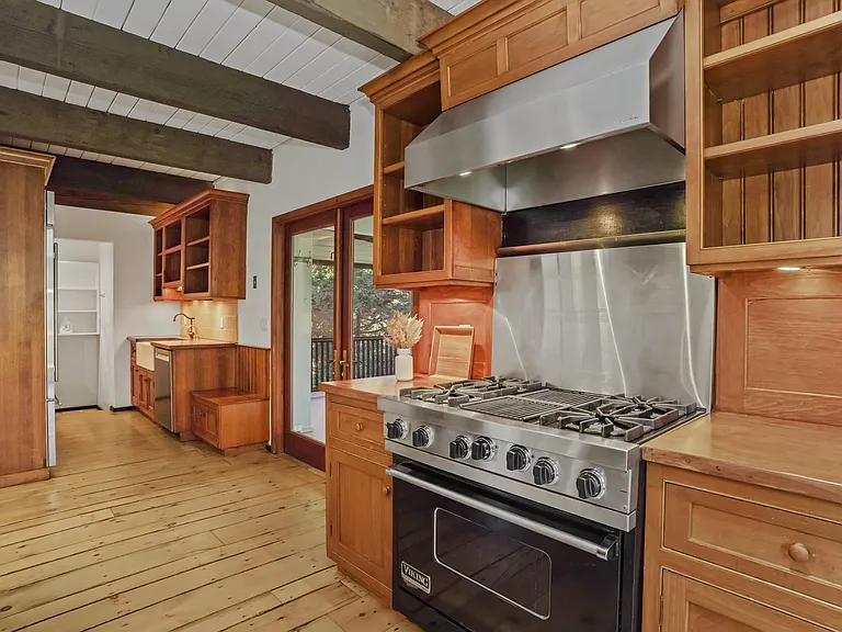 Updated Kitchen with Viking gas stove and range hood.