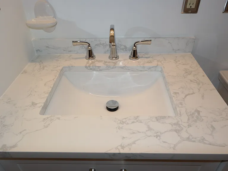 Marble top vanity and new faucet.
