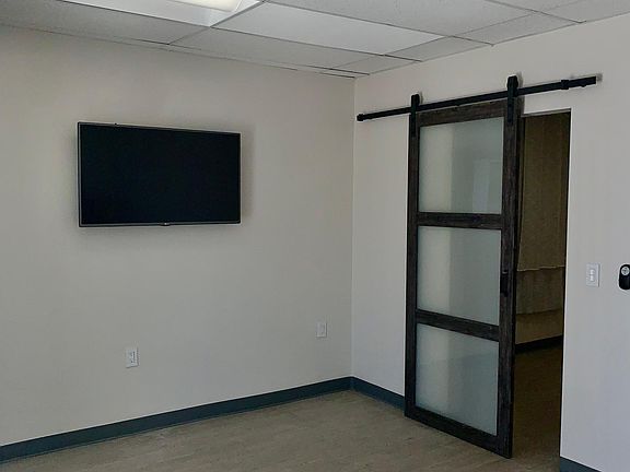 Bedroom includes Ceiling fan and Flat Screen TV