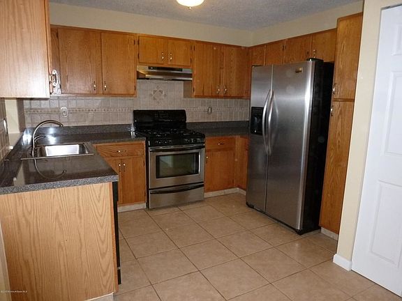 Updated kitchen with stainless steel appliances & backsplash
