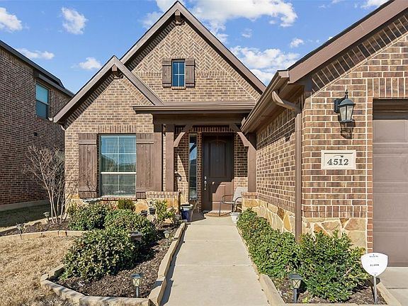 Beautiful Landscaping as you walk to the door.