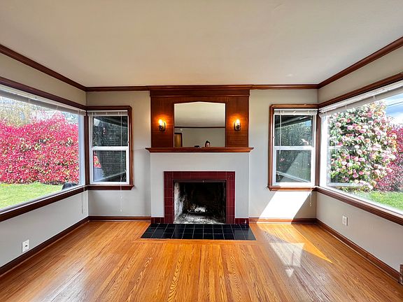 large corner windows greenery surround