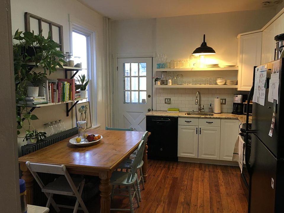 Renovated Kitchen with door to Screened in Porch and Backyar