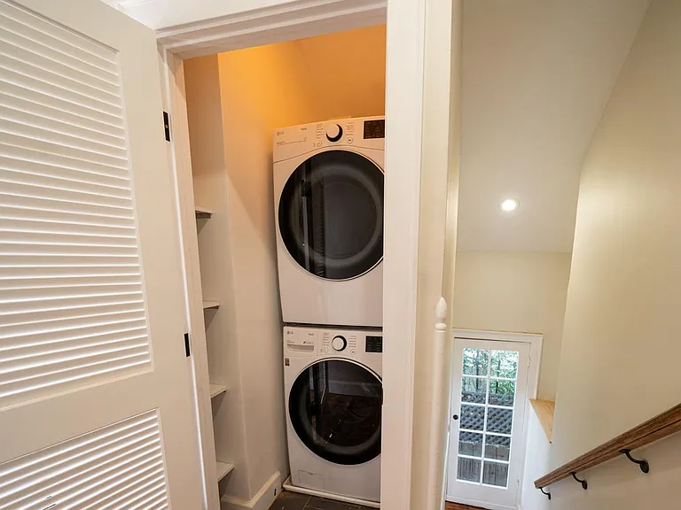 laundry closet situated between beds 2-5 in the upstairs hallway