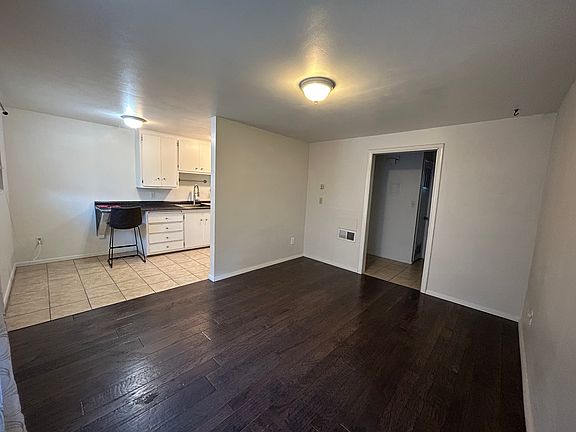 Main living room looking towards kitchen.