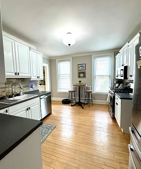 Kitchen with all new stainless steel appliances.