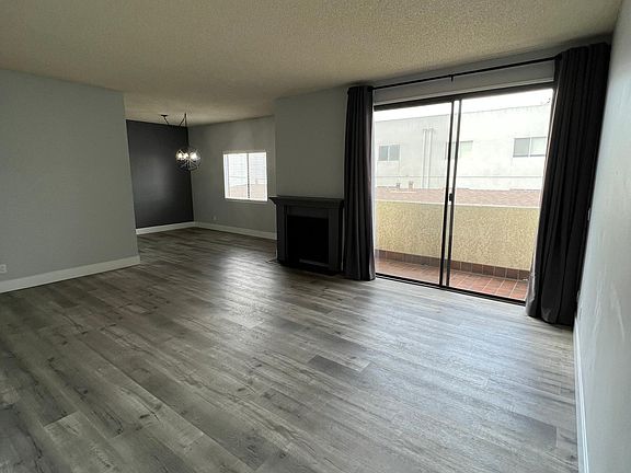 Living Room with Fireplace & Balcony