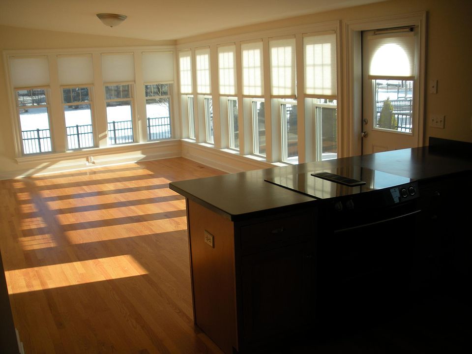First floor living room, with walk out fenced in private brick patio