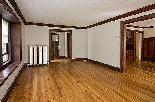 Living room and entry way. All hardwood floors throughout unit.