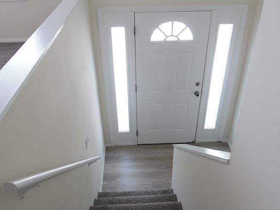 Front entrance to vinyl plank landing.