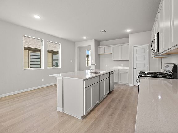 Kitchen in the Elm II home plan by Trophy Signature Homes - REPRESENTATIVE PHOTO