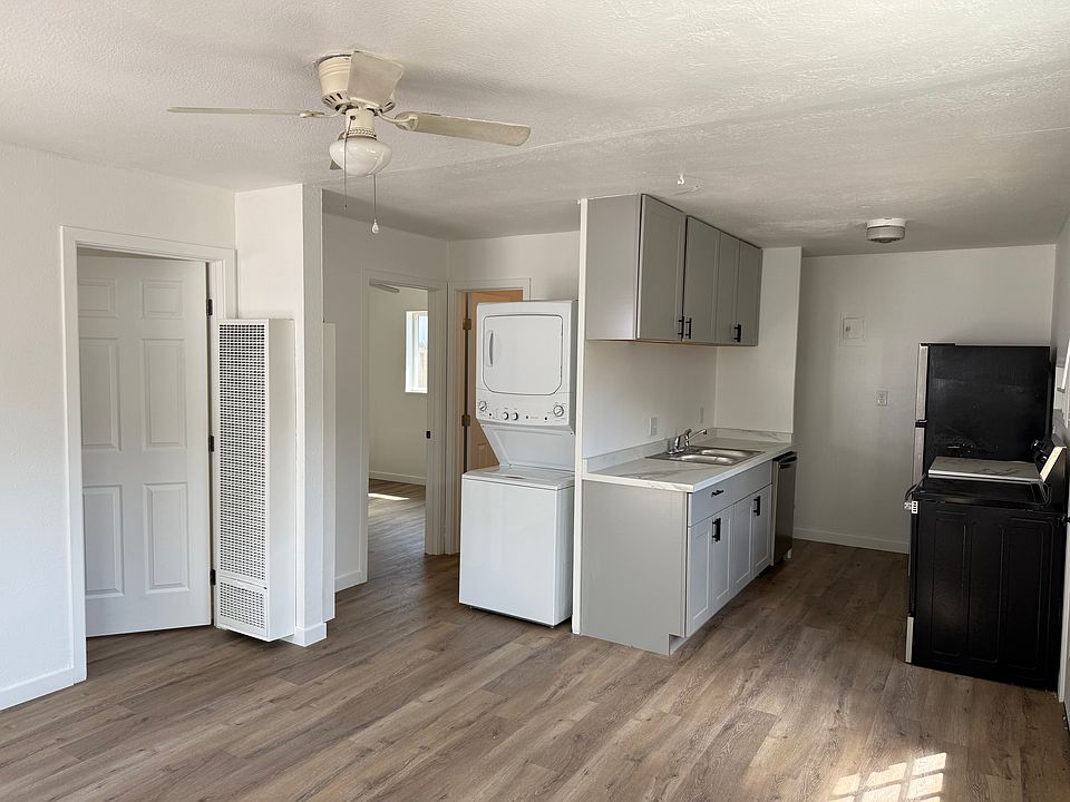 View from front door - open concept living/dining and kitchen space
