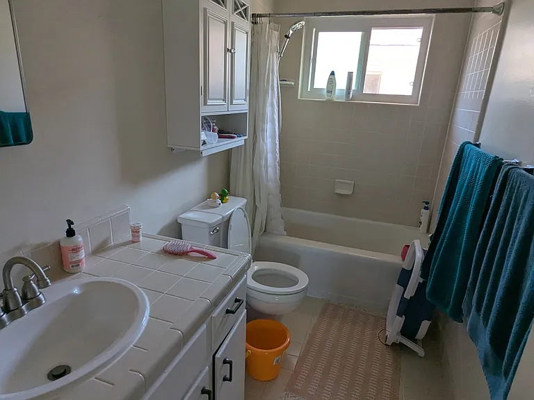 Hallway to bath on left and bedrooms