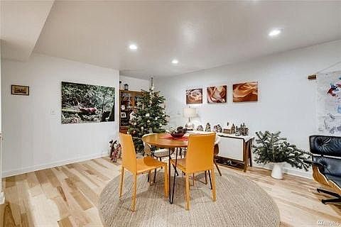 Downstairs dining area adjoins kitchen and living area, the center of the "L".