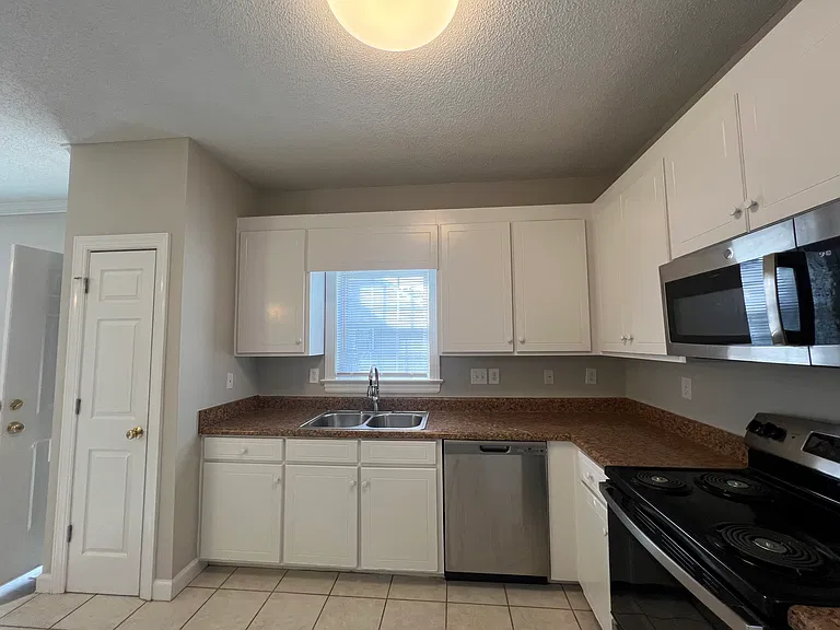Kitchen... New Stainless Steel Refrigerator and NEW Stainless Steel Stove