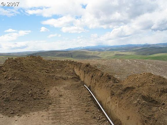 Deep silty soils that drain well yet hold moisture