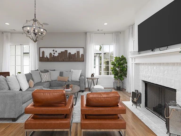 Cozy living room with comfortable seating, a fireplace and a Smart TV.