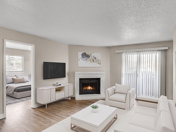 Living Room with Fireplace at Verona Apartments in Littleton, CO