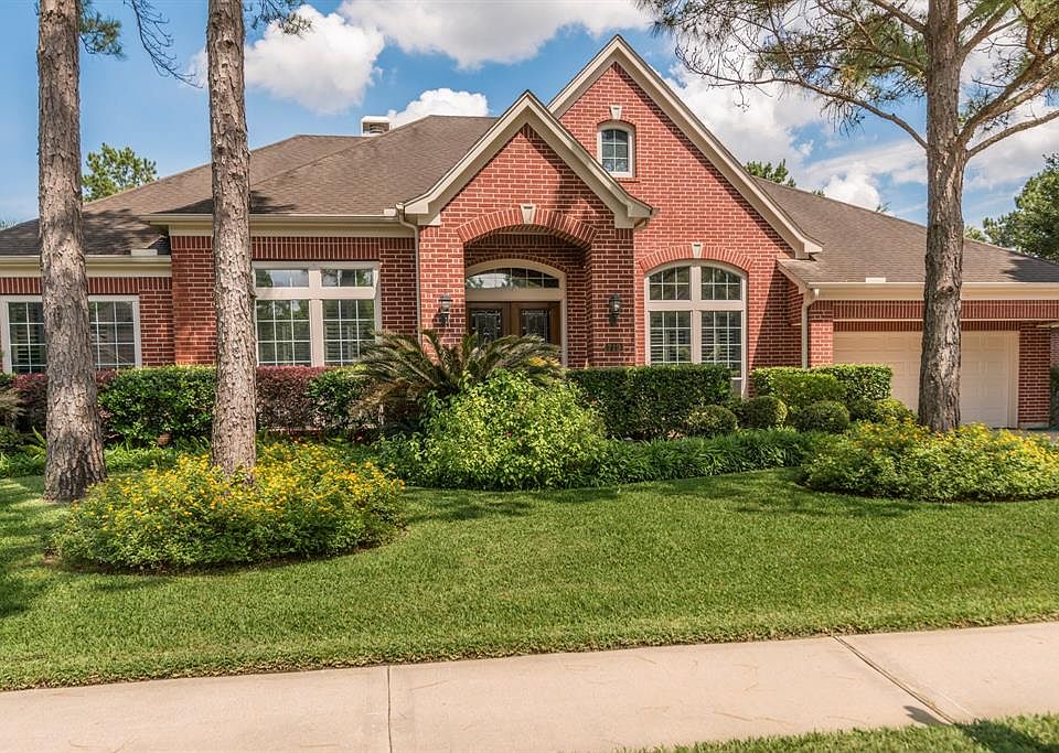 Beautiful front elevation of this one story stately home wonderfully landscaped.