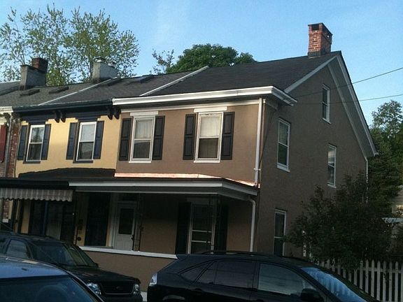 Side view of semi-detached home after newly redone stucco