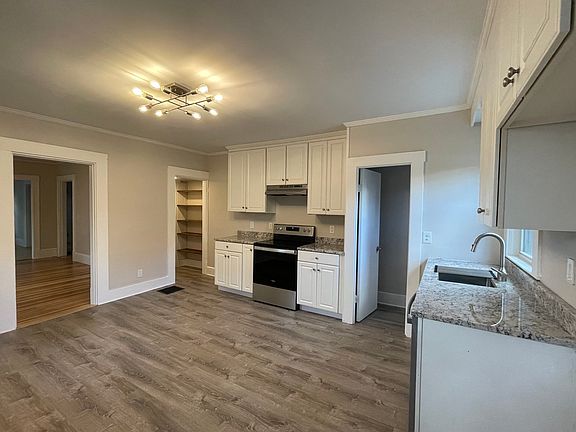 Eat in Kitchen with new flooring, lighting and granite countertops!