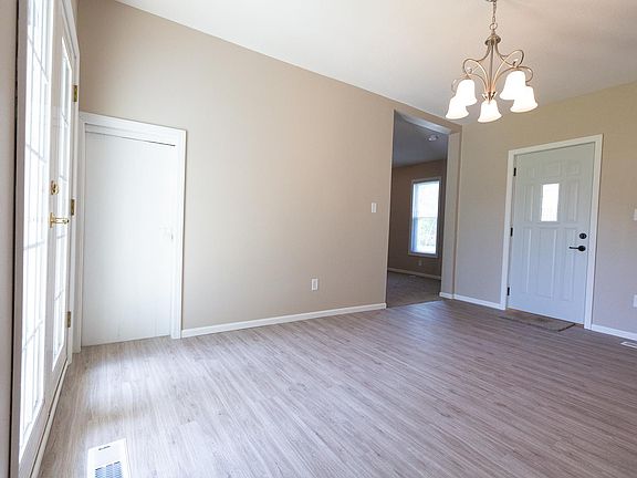 Dining Area. Door to basement on left. Entry to family room on right.