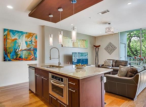 Open floor plan with lush treed view.