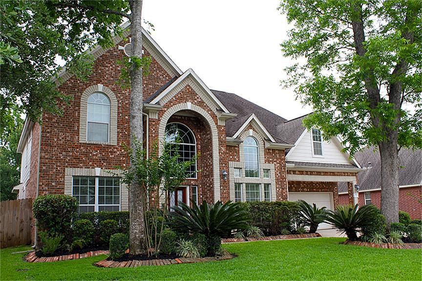 Front Elevation with mature trees & landscaping