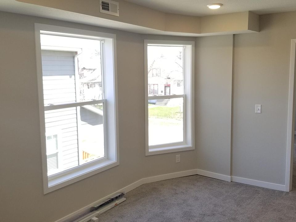 In Living Room looking at bay windows